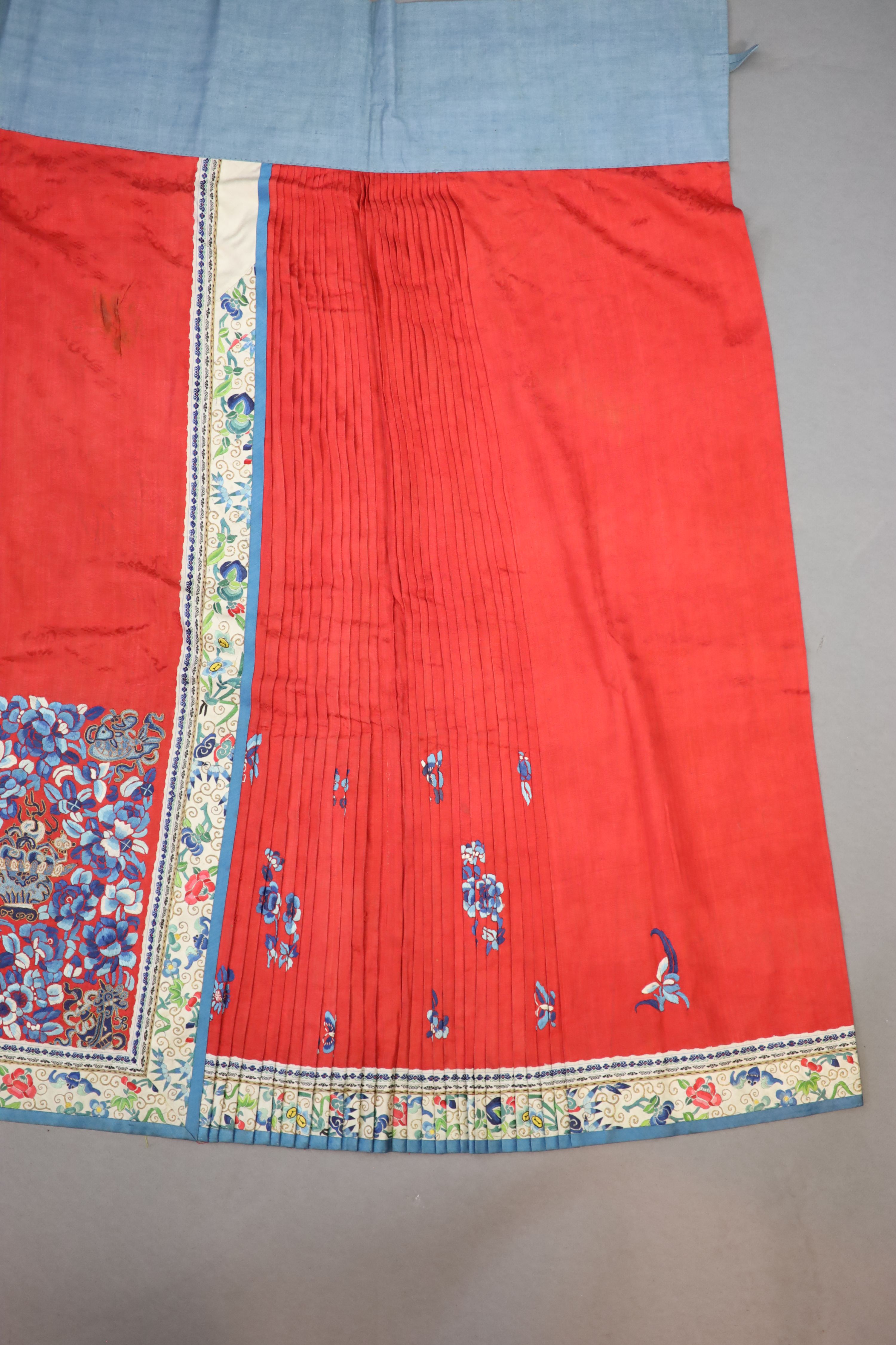 A 19th century Chinese red ground silk skirt